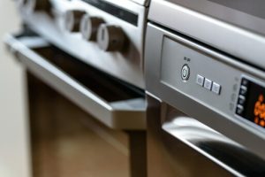 Angled close up of a metalic looking oven.