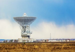 Daytime Large Radio Telescope Pointing Up Into Sky